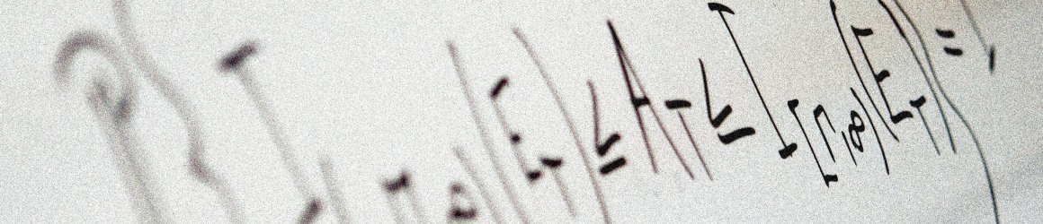 Mathematical equations written on a whiteboard