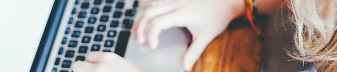 a person typing on a laptop a person typing on a laptop