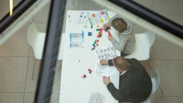 Image from last year's festival of children doing puzzles Image from last year's festival of children doing puzzles