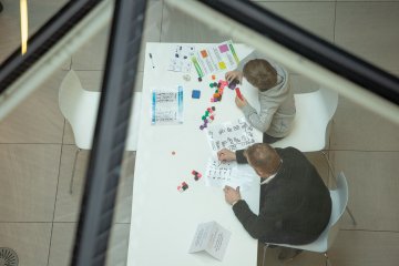 Image from last year's festival of children doing puzzles