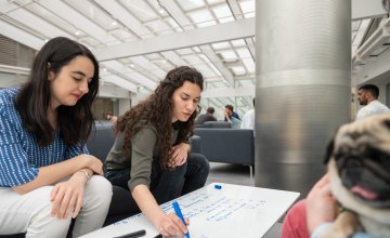Photo of two female DPhil students