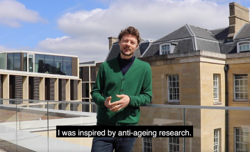 Image of Sam Palmer on the  roof terrace of the Andrew Wiles Building