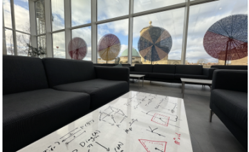 Common Room with writing on white tables