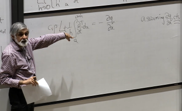 Photo of Philip Maini lecturing