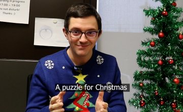Opening shot of video - James Munro in Christmas jumper