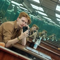 A picture of myself, in a cafe full of mirrors. 