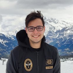 Peter smiling on top of the snow covered mountain Männlichen