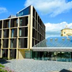 Photo of the Andrew Wiles Building front entrance on a sunny day