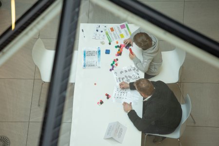 Image from last year's festival of children doing puzzles Image from last year's festival of children doing puzzles