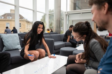 Image of Oxford Mathematics graduate students in the Common Room