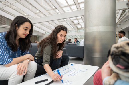 Photo of two female DPhil students