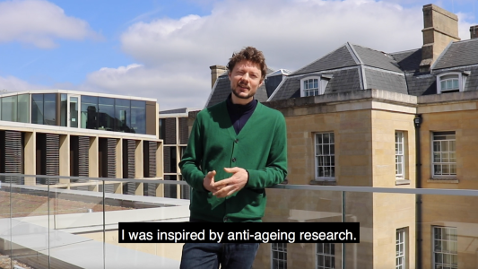 Image of Sam Palmer on the  roof terrace of the Andrew Wiles Building Image of Sam Palmer on the  roof terrace of the Andrew Wiles Building