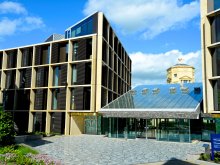 Photo of the Andrew Wiles Building front entrance on a sunny day