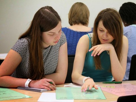 Two girls discussing mathematics