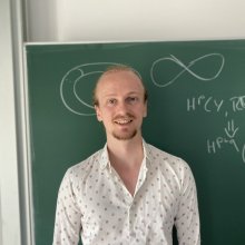 Lukas in front of a blackboard
