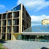 Photo of the Andrew Wiles Building front entrance on a sunny day