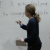 Image of lecturer (Melanie Rupflin) at the whiteboard