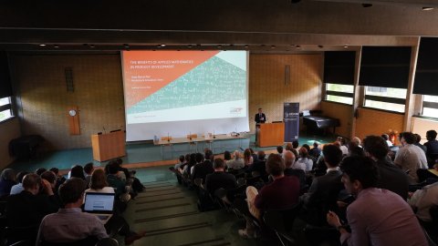 Reddick lecture 2022. Speaker at the front of a large lecture theatre