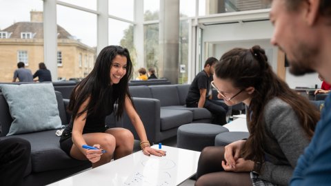 Image of Oxford Mathematics graduate students in the Common Room