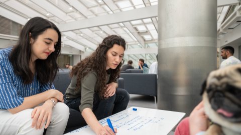 Photo of two female DPhil students