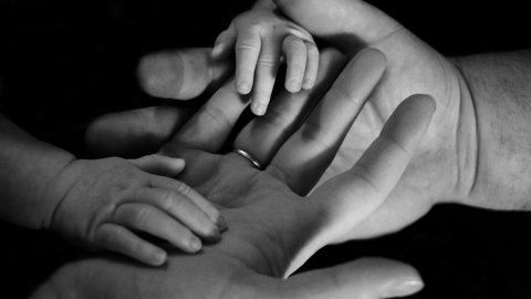 interlinked hands adult/child