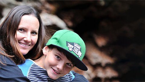 A parent with a child in an outdoor setting