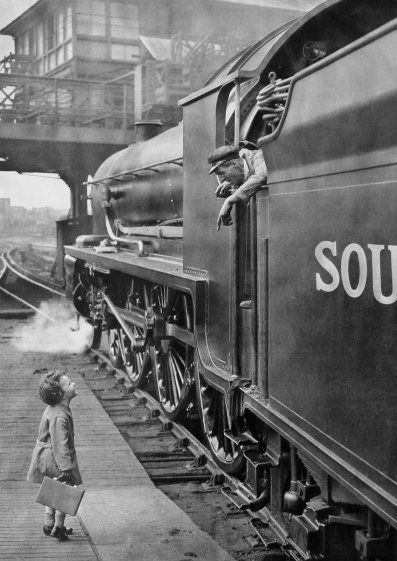 Photo of little boy talking to engine driver Photo of little boy talking to engine driver